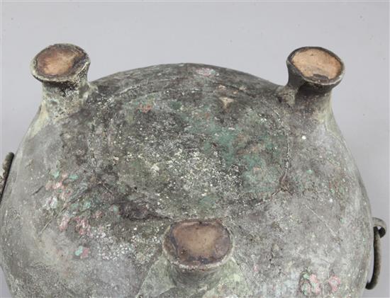 A Chinese archaic bronze tripod vessel base, Dui, Eastern Zhou dynasty, 6th-5th century B.C., 25cm wide, 15cm high, hole, lacking cover